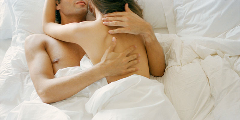 Man And Woman Having Sex In Bed
